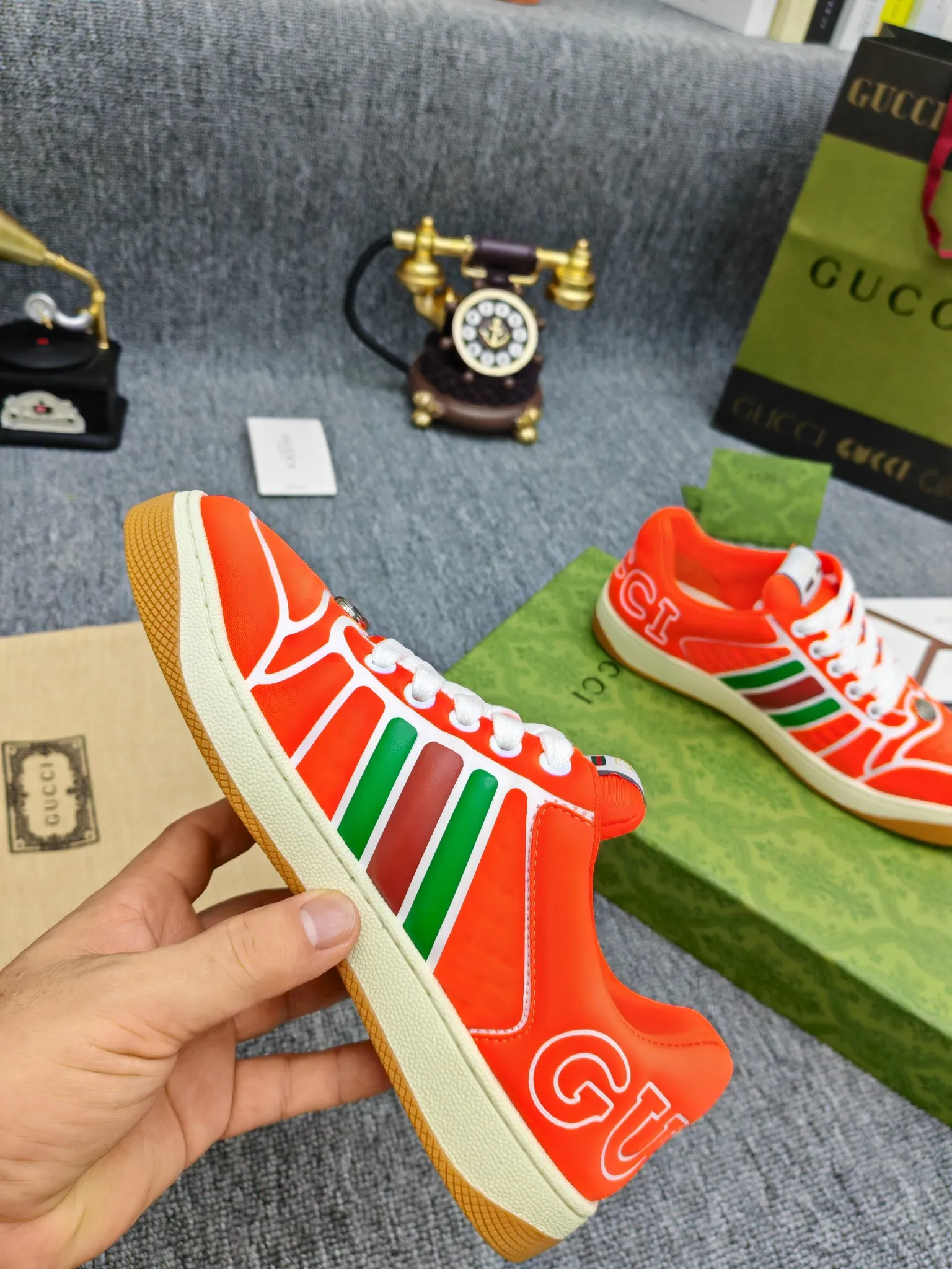 Factory price 600💰Screener series embellished web sneakers. This item is from the Gucci Lido series. Its design is inspired by the summer style and beach clubs of the Italian coast. The Screener series of sneakers draws inspiration from classic sneakers from the 1970s and takes its name from a special defensive move in sports. This shoe from the 2024 Pre-Fall collection is crafted from yellow rubber, a technical and malleable opaque material, with striped webbing on the sides and an embossed Gucci printed logo on the heel. Yellow rubber, opaque and technological in appearance. Red and green webbing decorated with metal Double G oval enamel details. Gucci printed embossed logo. Women 35-40, men 38-45, (men 38 and 45 need to be customized)